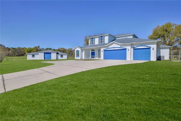 a view of a house with a yard
