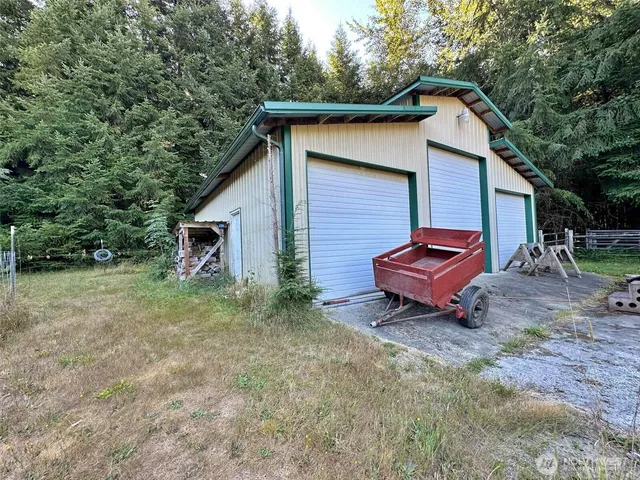 a view of a house with a yard and sitting area