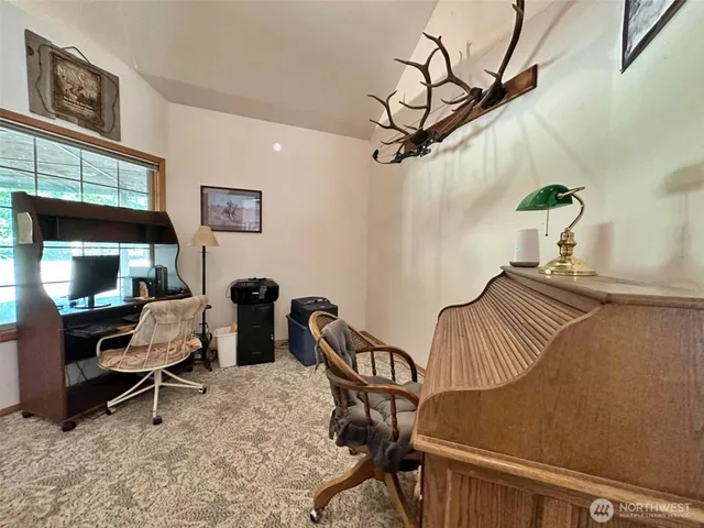 a view of a workspace with furniture