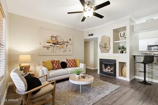 a living room with furniture and a fireplace