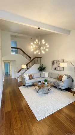 a lobby with furniture and a chandelier