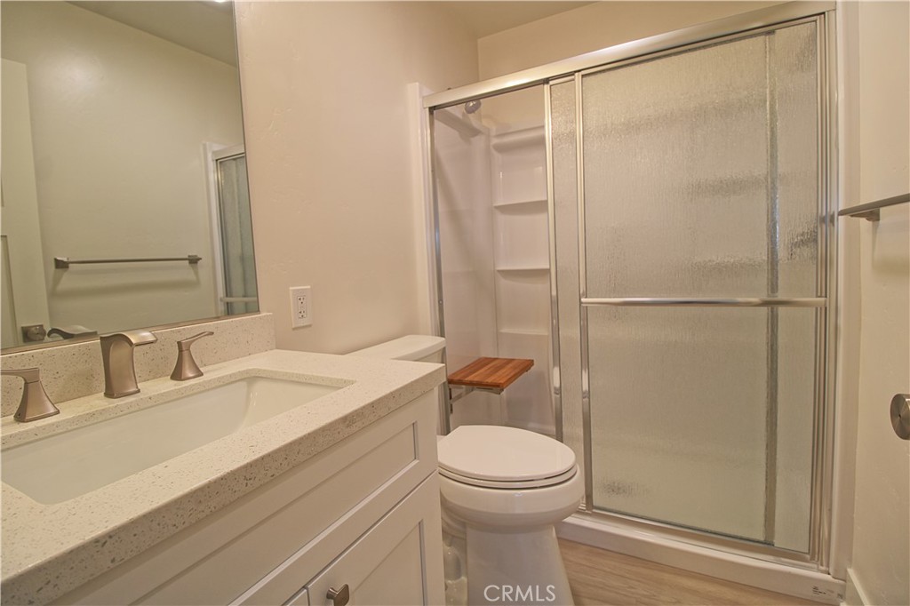 34464 Avena Way Yucaipa, CA 92399 - Photo 13 of 17 a bathroom with a sink a toilet and shower