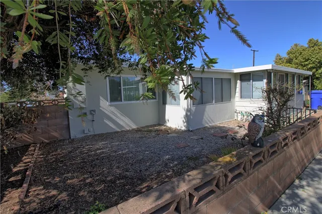 a view of a house with a tree