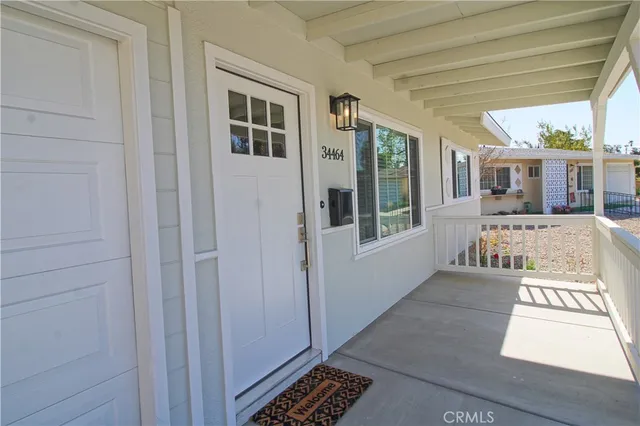 a view of a porch with wooden floor and outdoor space