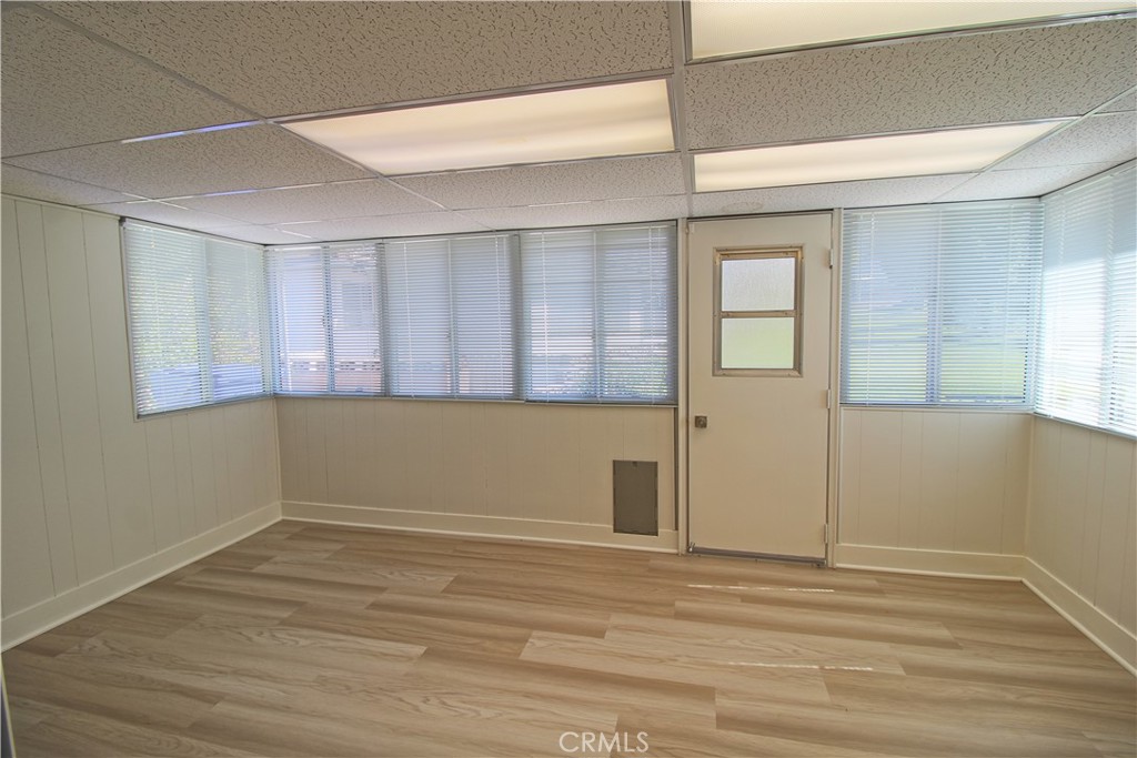 34464 Avena Way Yucaipa, CA 92399 - Photo 8 of 17 a view of empty room with wooden floor and fan