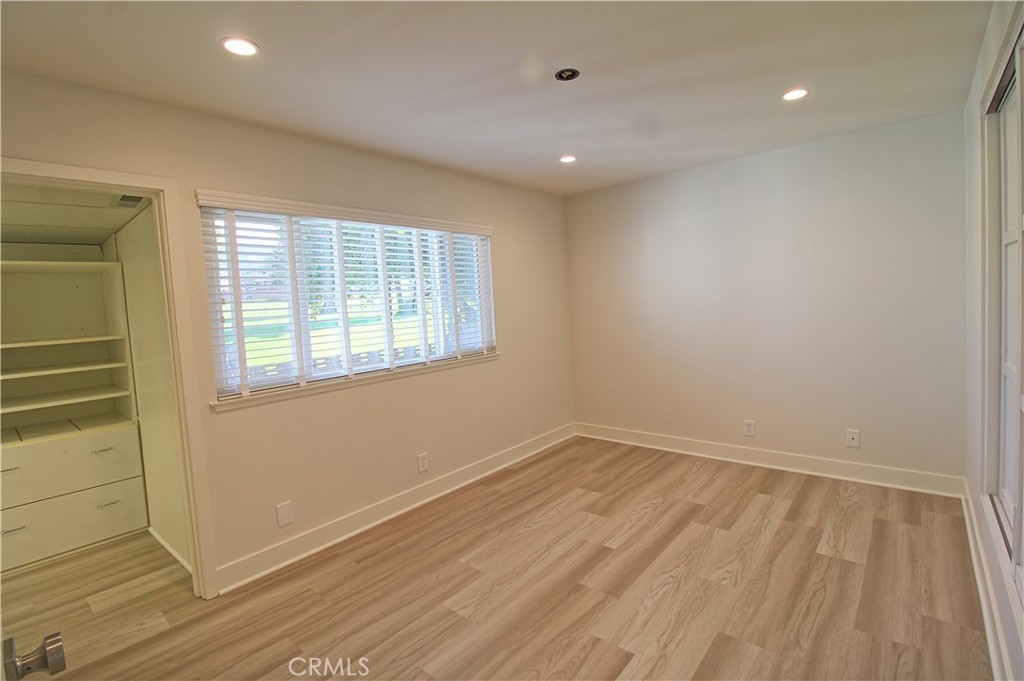 34464 Avena Way Yucaipa, CA 92399 - Photo 10 of 17 an empty room with wooden floor and windows
