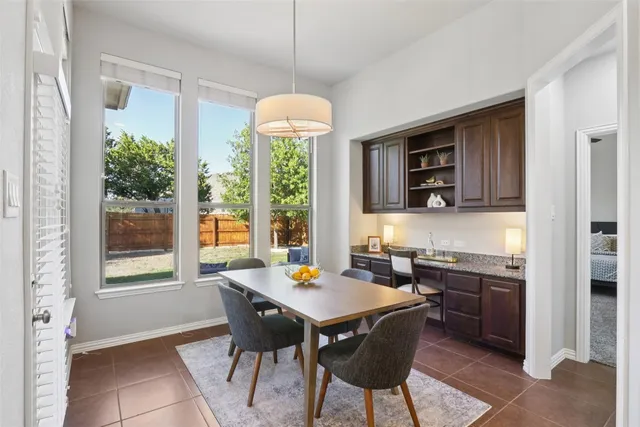 a view of a dining room with furniture window and outside view