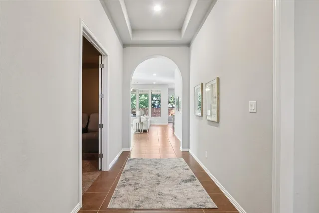 wooden floor in a hall with a window