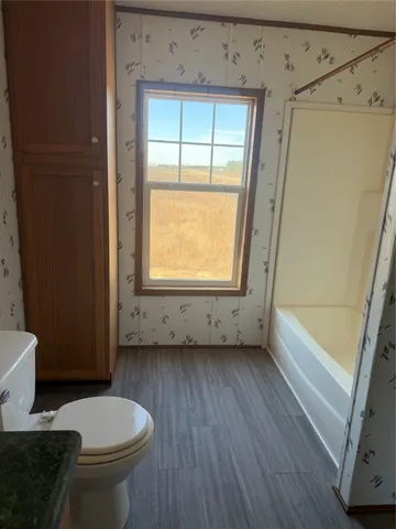 a bathroom with a toilet a sink and a bathtub