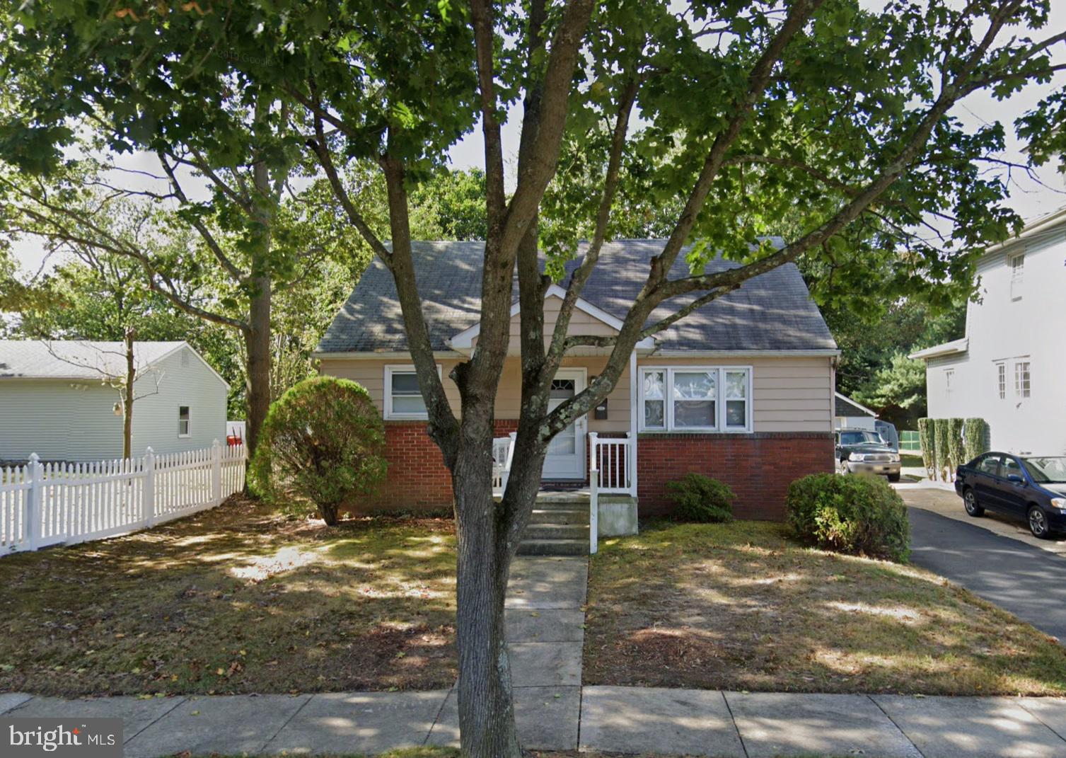 107 Laurel Avenue Glassboro, NJ 08028 - Photo 1 of 17 a front view of a house with a yard