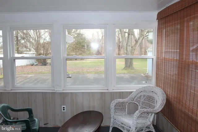 a view of a room with furniture and windows
