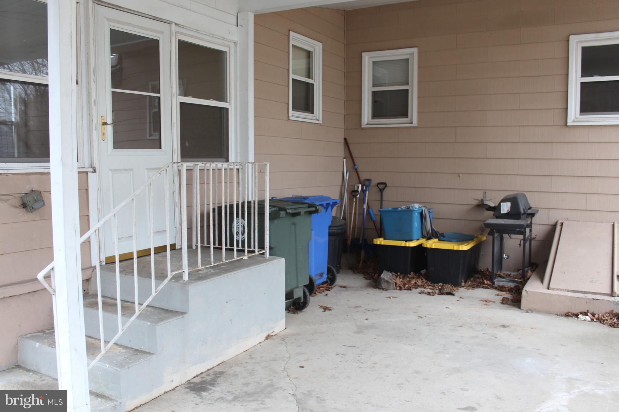 107 Laurel Avenue Glassboro, NJ 08028 - Photo 15 of 17 a view of a patio with a table and chairs