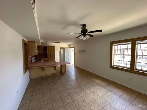 a view of game room with windows