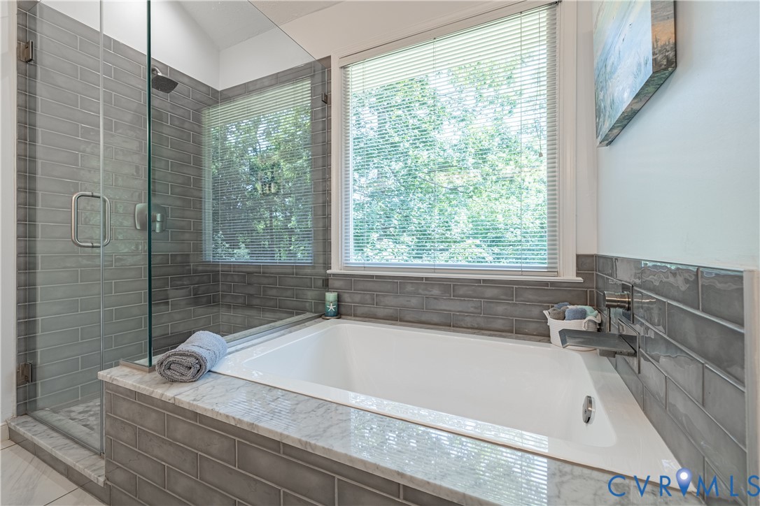 4501 Foxwood Road Chester, VA 23831 - Photo 24 of 42 Built-in tub with stone-finish surround, accompani