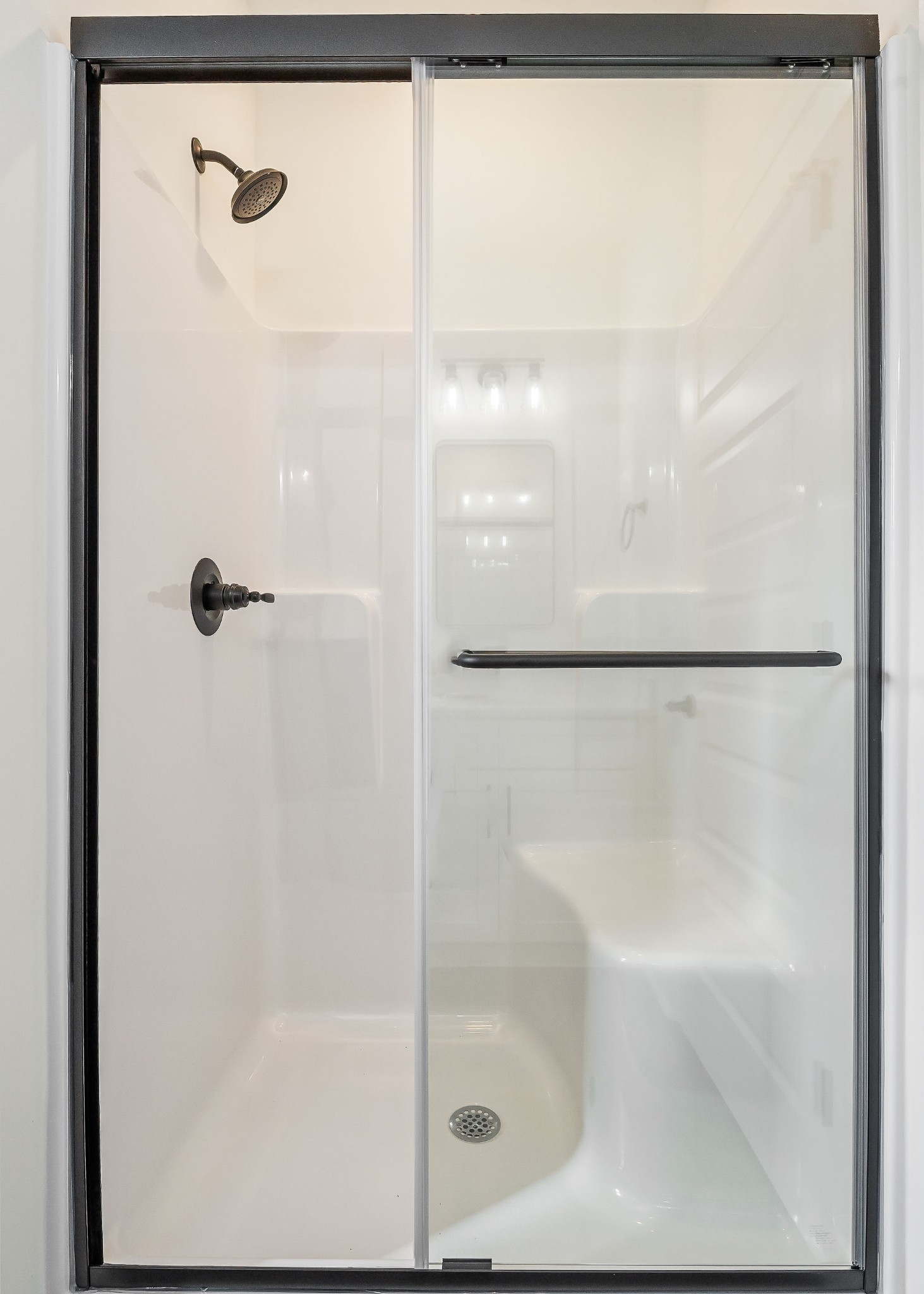 209 Brandon Drive McMinnville, TN 37110 - Photo 25 of 31 a bathroom with a glass shower door