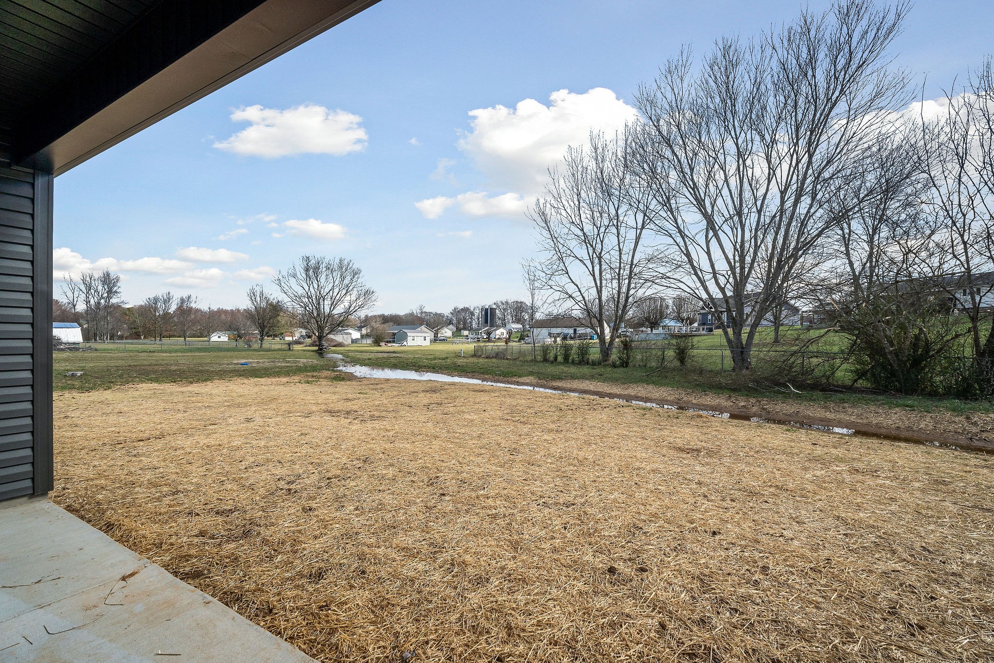 209 Brandon Drive McMinnville, TN 37110 - Photo 29 of 31 a view of a lake with houses in the back