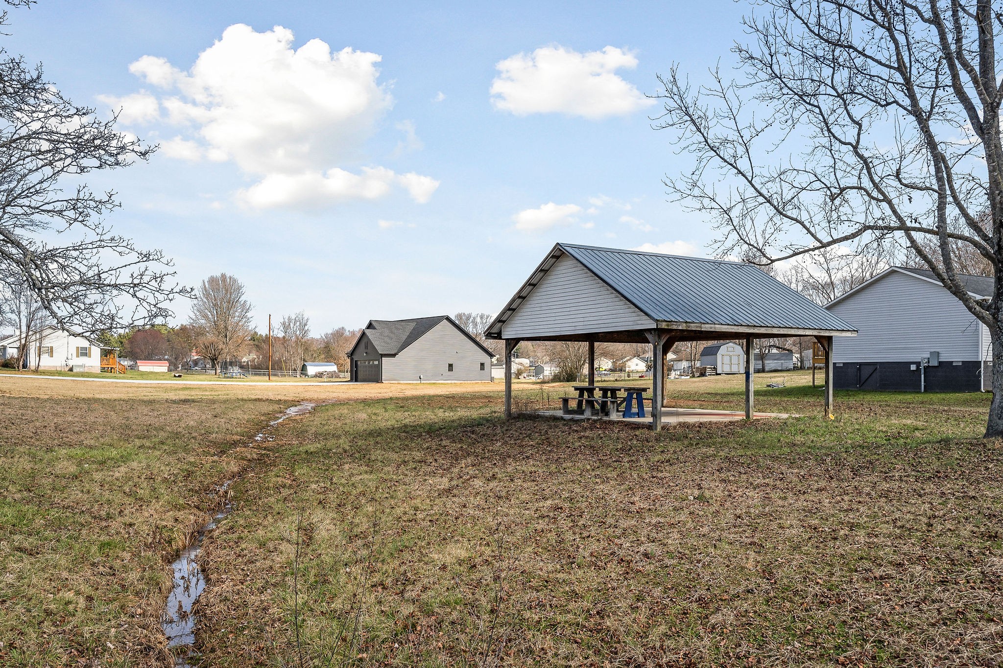 209 Brandon Drive McMinnville, TN 37110 - Photo 30 of 31 a house that has a tree in front of it