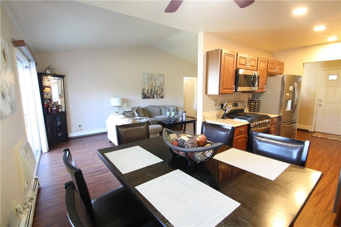 Combination living room kitchen area boast new stainless steel appliances, counter tops , cabinets and washer. Hardwood floors throughout. slider doors to balcony