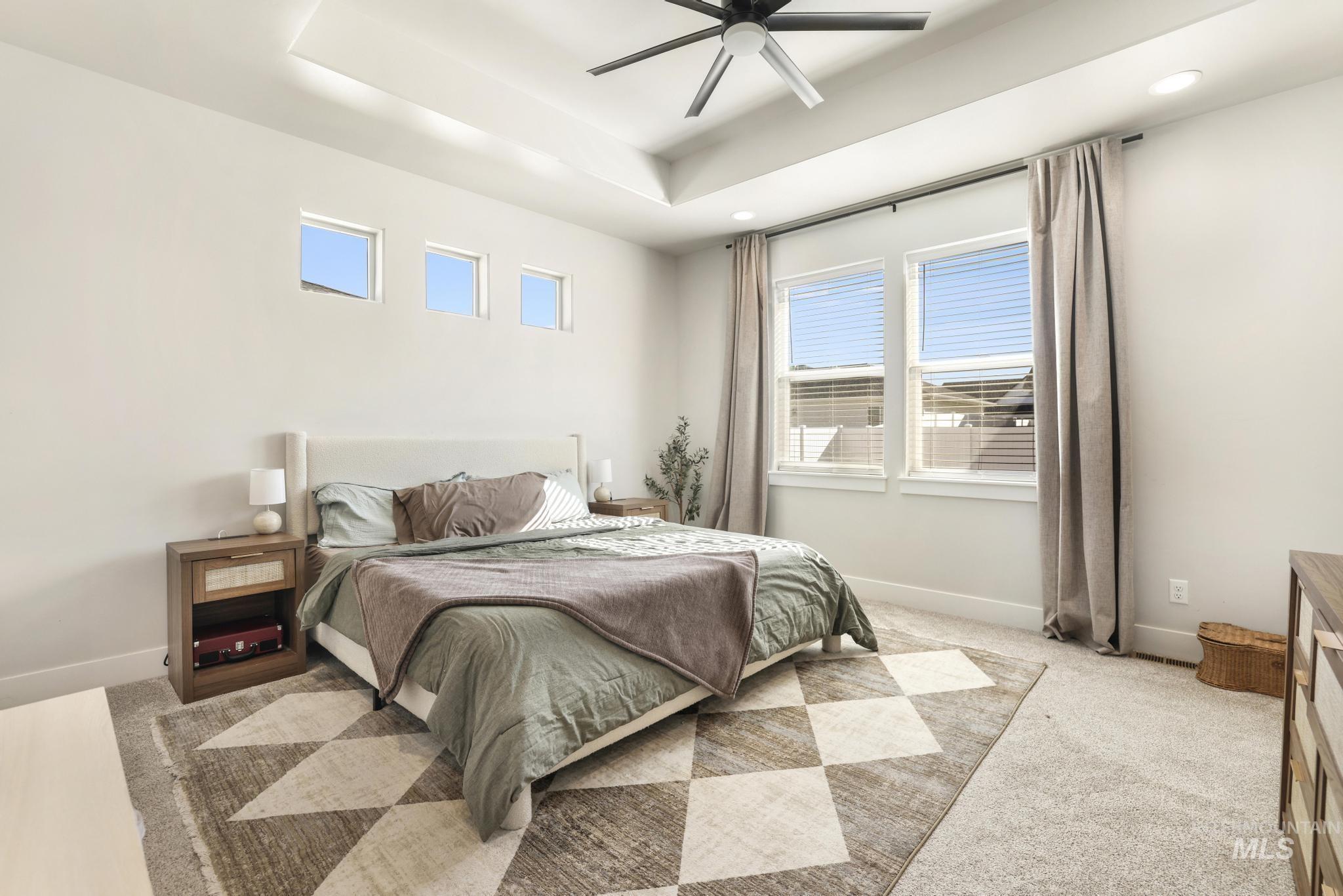 1231 Frank Henry Road Twin Falls, ID 83301 - Photo 17 of 48 Carpeted bedroom with ceiling fan, a raised ceiling, and recessed lighting