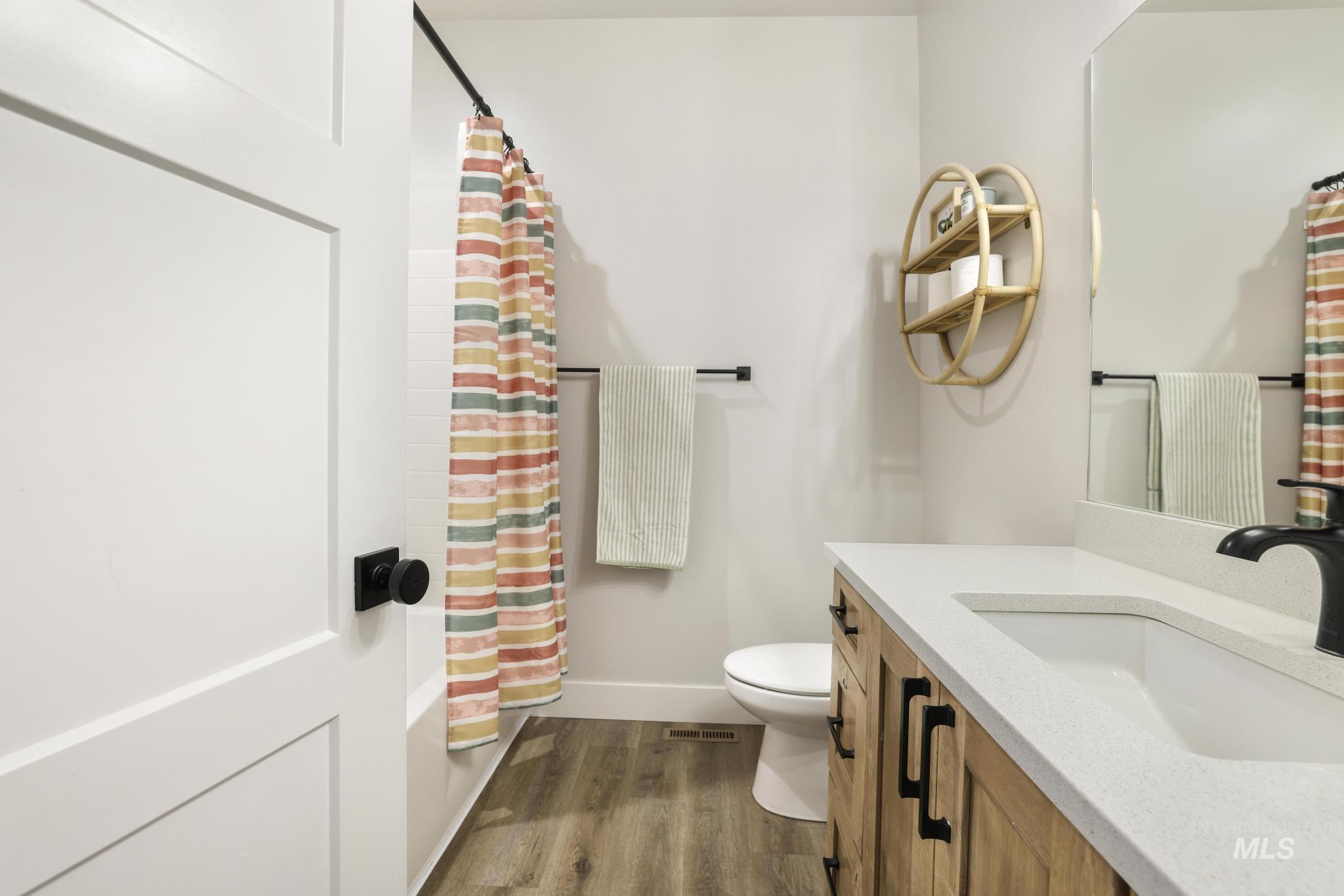 1231 Frank Henry Road Twin Falls, ID 83301 - Photo 25 of 48 Full bathroom with vanity and dark wood-type flooring