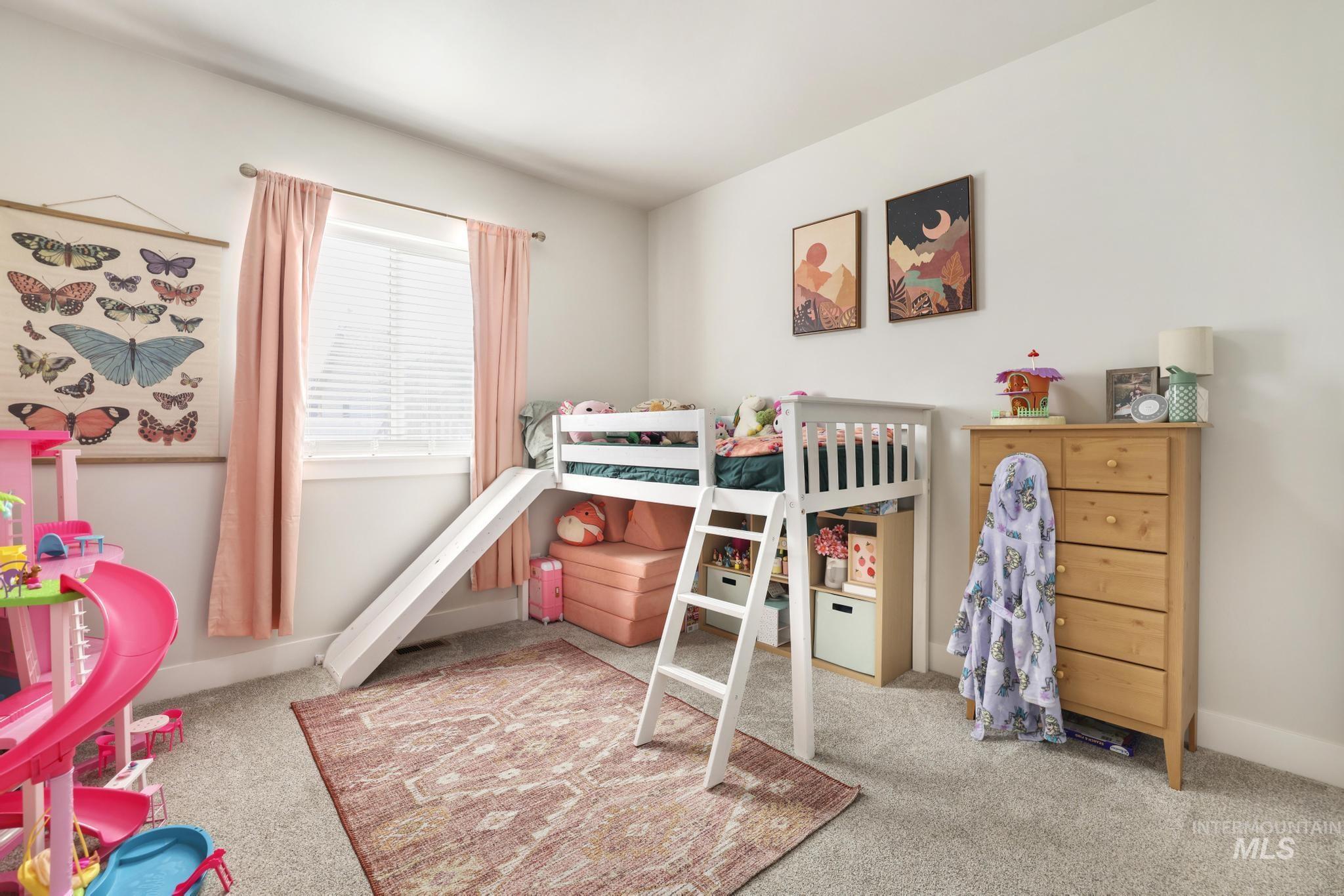 1231 Frank Henry Road Twin Falls, ID 83301 - Photo 26 of 48 Bedroom featuring light colored carpet and baseboards