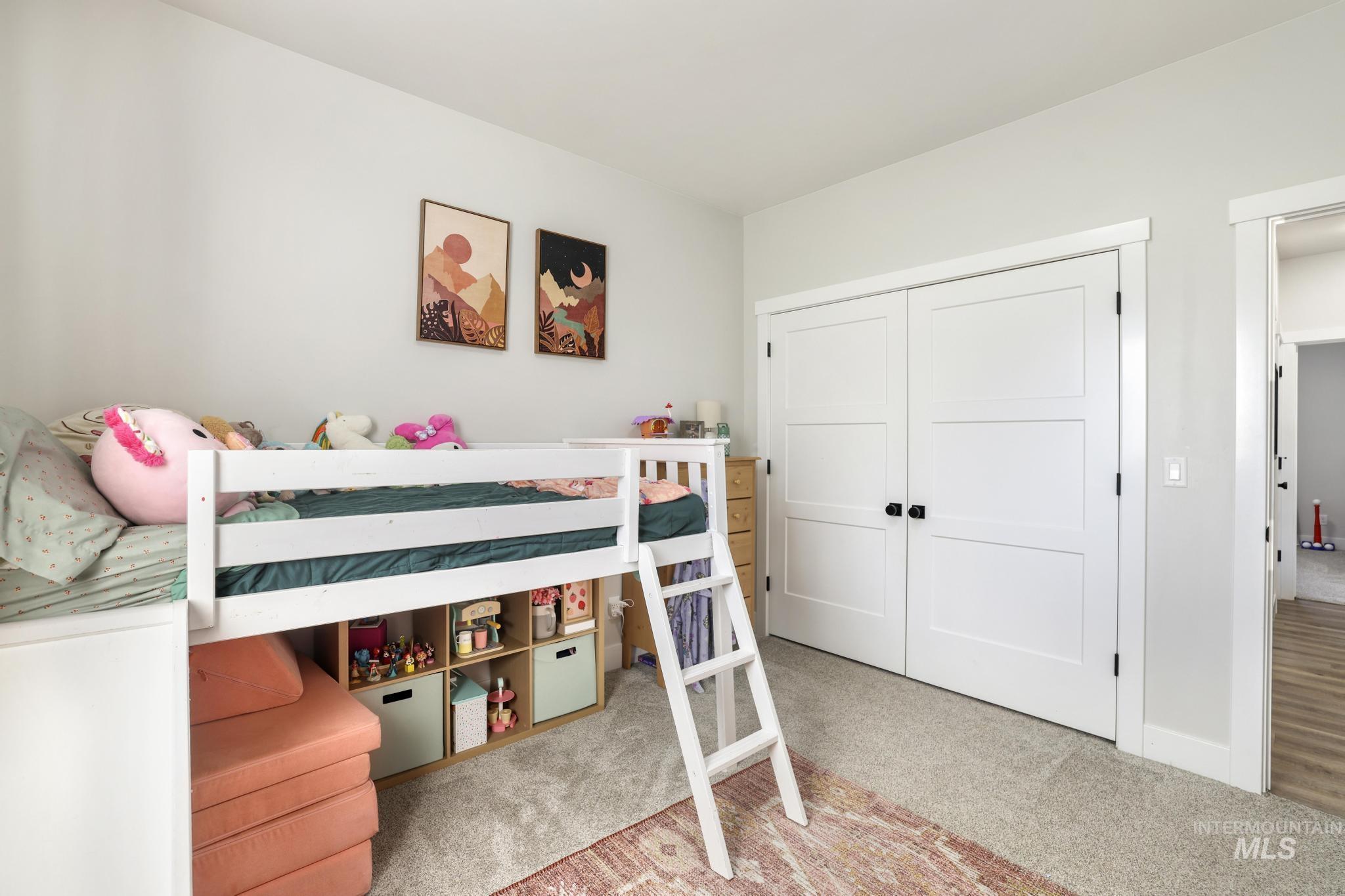 1231 Frank Henry Road Twin Falls, ID 83301 - Photo 27 of 48 Bedroom featuring light carpet and a closet