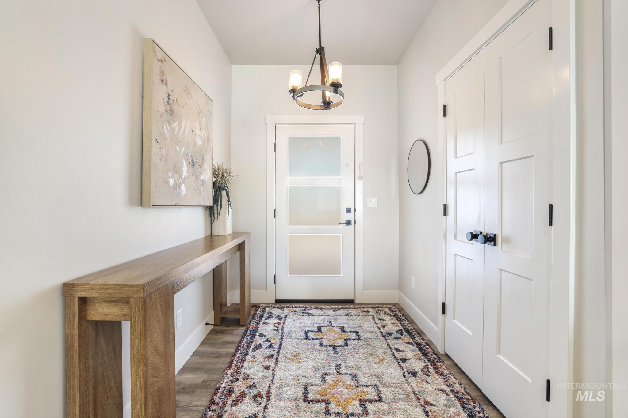 1231 Frank Henry Road Twin Falls, ID 83301 - Photo 5 of 48 Foyer entrance featuring suspended lighting and light wood-style flooring