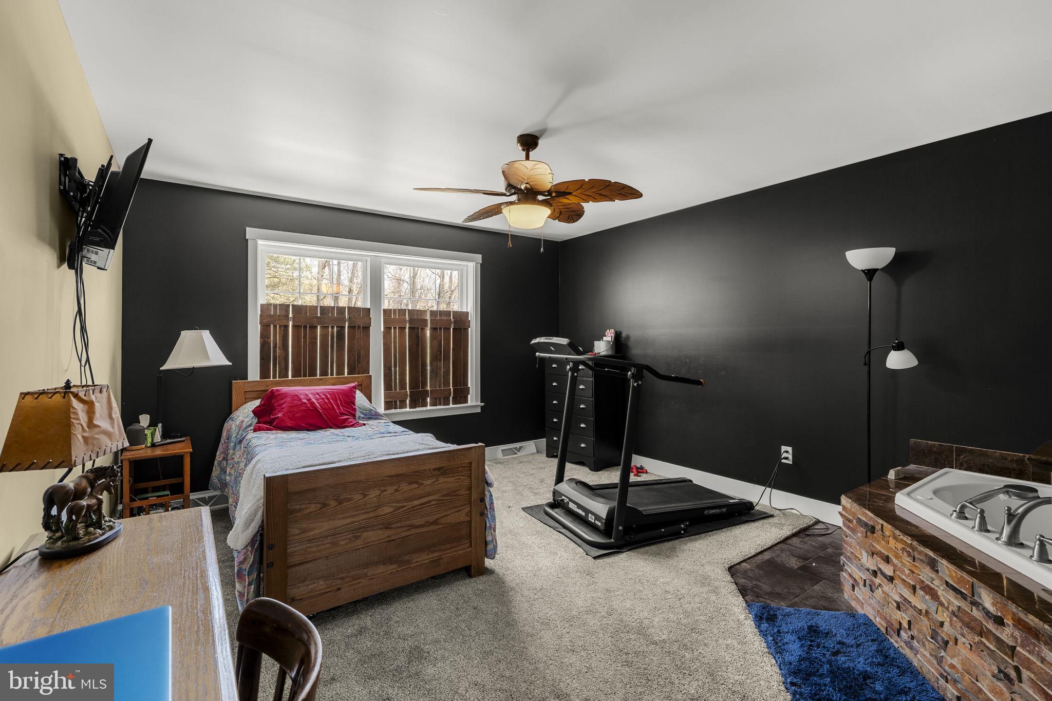 744 Lime Quarry Road Gap, PA 17527 - Photo 42 of 76 a living room with furniture a window and gym equipment
