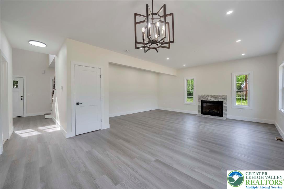 2840 Jacksonville Road Bethlehem, PA 18017 - Photo 11 of 29 a view of empty room with wooden floor and fireplace