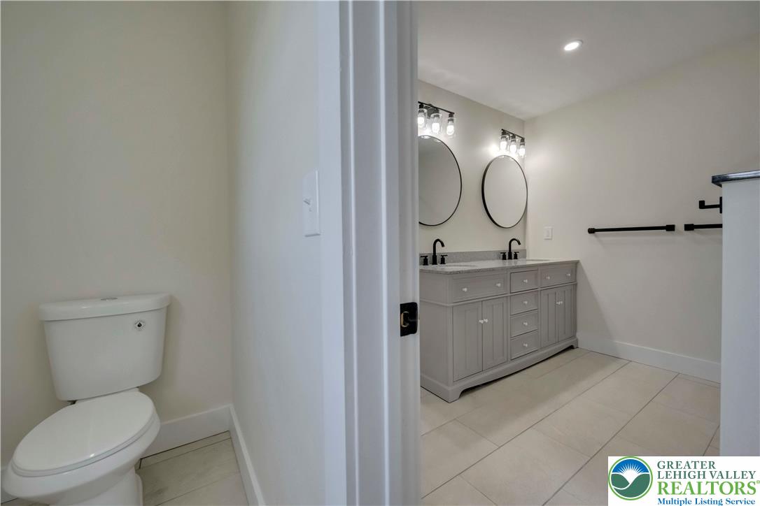 2840 Jacksonville Road Bethlehem, PA 18017 - Photo 19 of 29 a bathroom with a toilet a sink and mirror