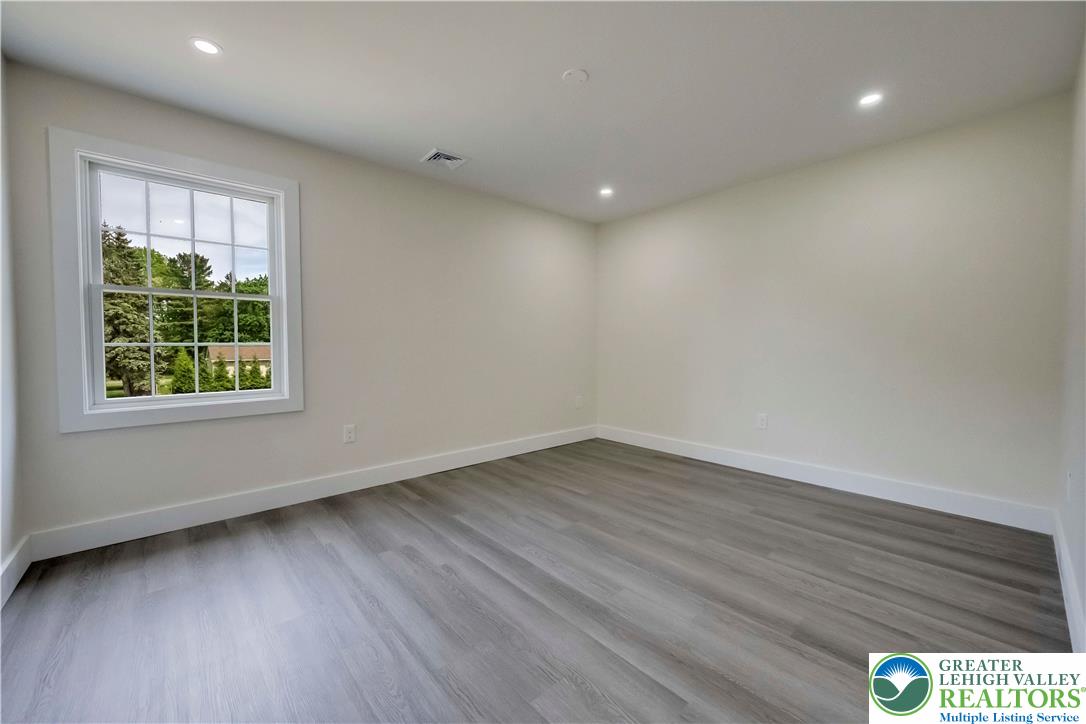 2840 Jacksonville Road Bethlehem, PA 18017 - Photo 23 of 29 a view of an empty room with wooden floor and a window