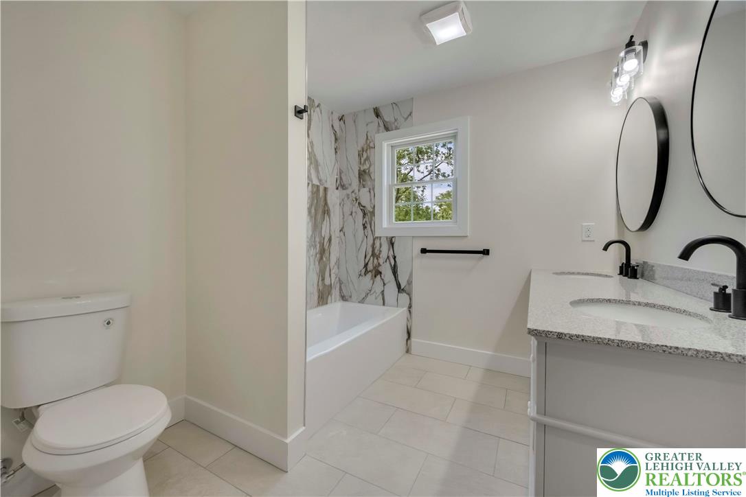2840 Jacksonville Road Bethlehem, PA 18017 - Photo 27 of 29 a bathroom with a granite countertop sink toilet and shower