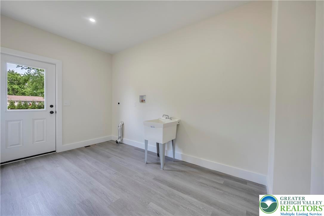 2840 Jacksonville Road Bethlehem, PA 18017 - Photo 28 of 29 a view of an empty room with wooden floor and a window