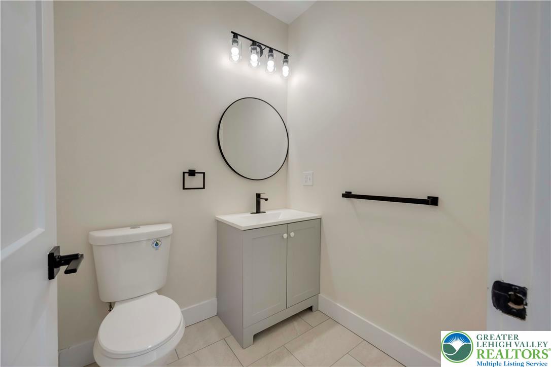 2840 Jacksonville Road Bethlehem, PA 18017 - Photo 29 of 29 a bathroom with a toilet a sink and mirror