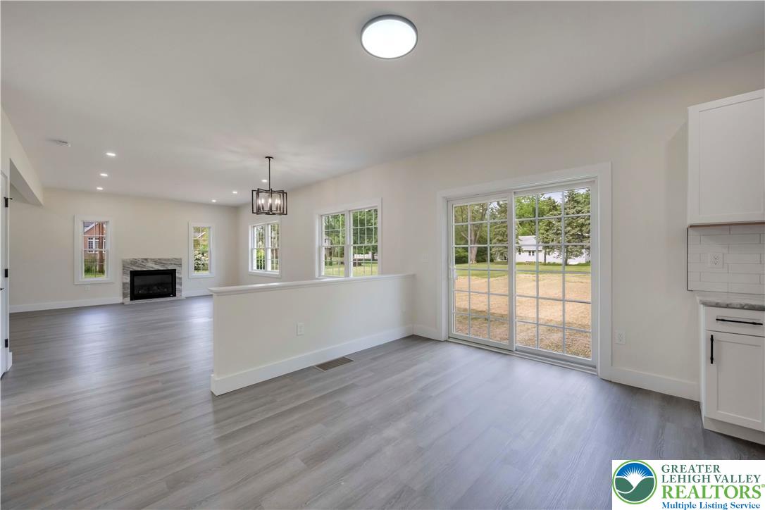 2840 Jacksonville Road Bethlehem, PA 18017 - Photo 10 of 29 a view of an empty room with a window and wooden floor