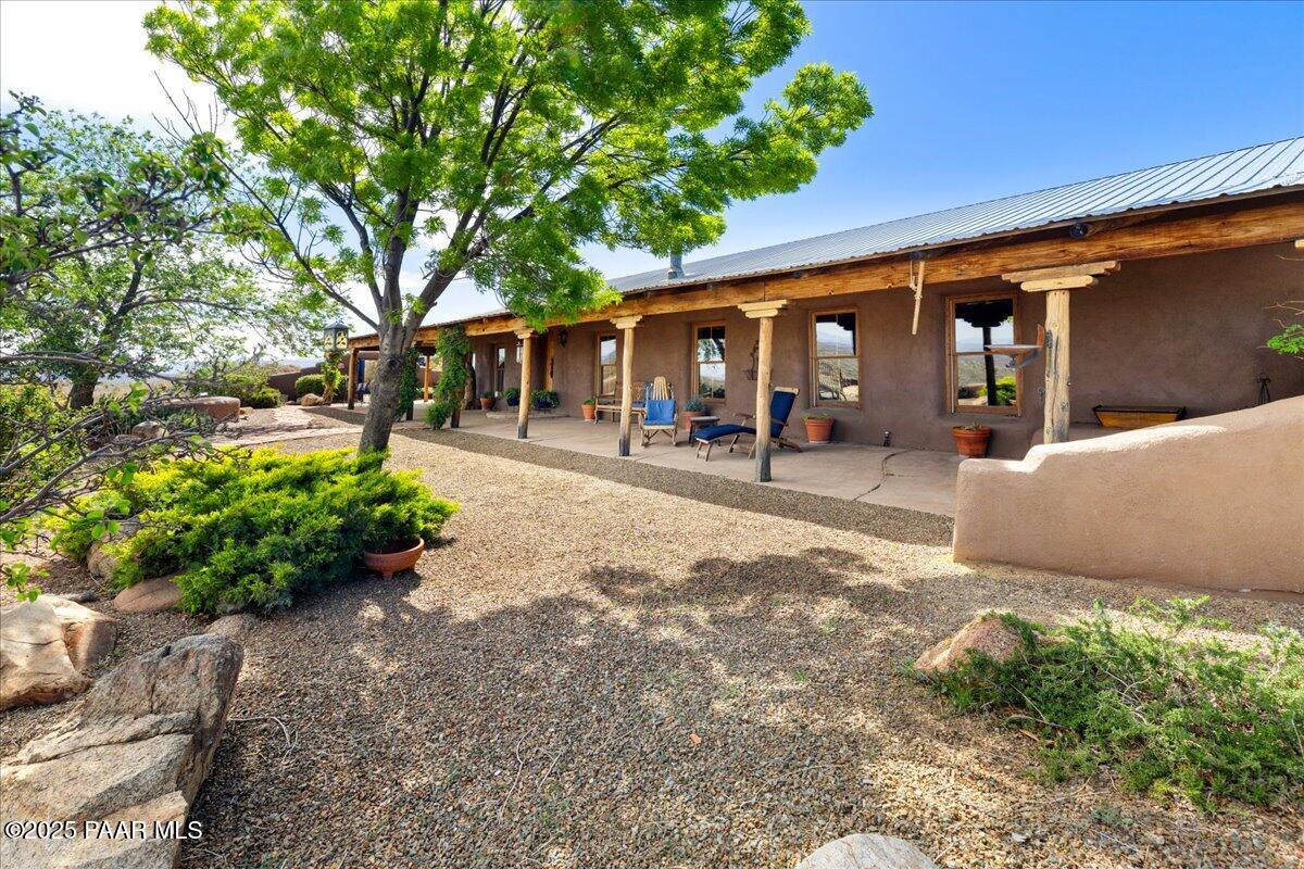 18300 Peacemaker Drive Dewey, AZ 86327 - Photo 13 of 47 a front view of a house with garden