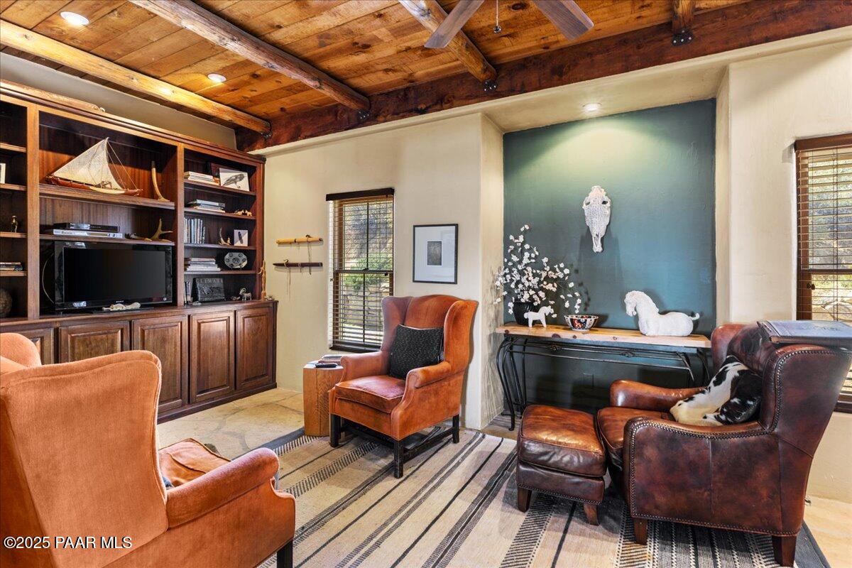 18300 Peacemaker Drive Dewey, AZ 86327 - Photo 28 of 47 a living room with furniture and a flat screen tv