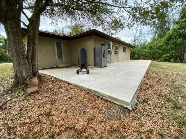 a house with trees in the background