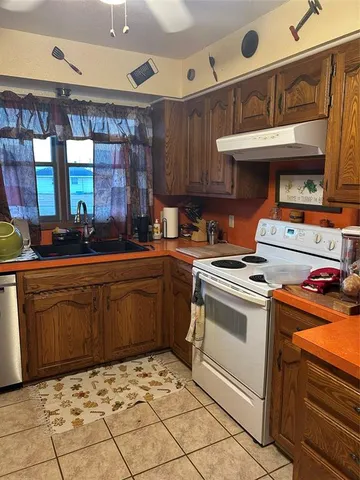 a kitchen with a stove and a sink
