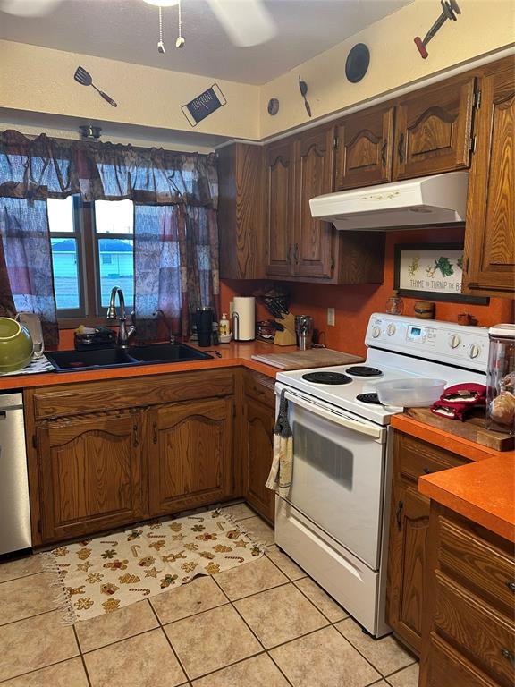 2020 Cedar Street Megargel, TX 76374 - Photo 12 of 29 a kitchen with a stove and a sink
