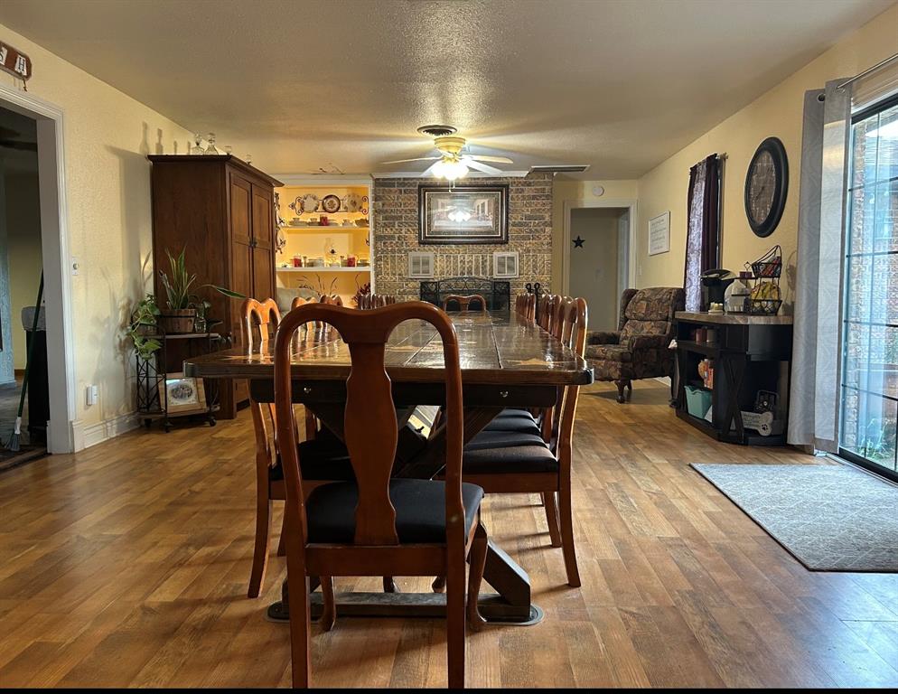 2020 Cedar Street Megargel, TX 76374 - Photo 16 of 29 a view of a dining room with furniture and chandelier