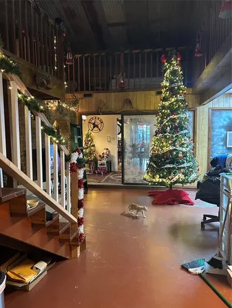 a room with lots of furniture and a chandelier