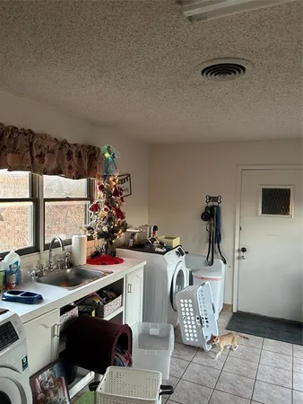a view of a dining room with furniture and window