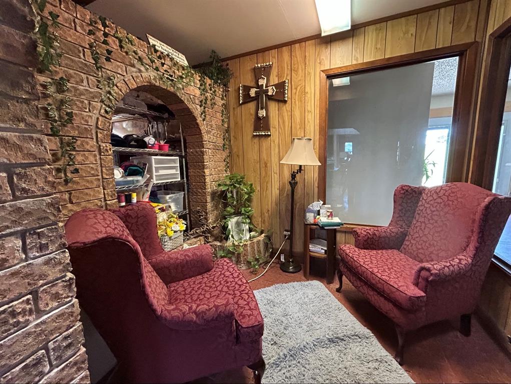 2020 Cedar Street Megargel, TX 76374 - Photo 25 of 29 a living room with furniture and a fireplace