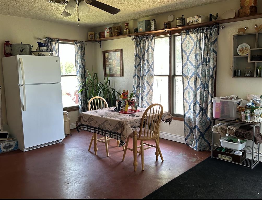 2020 Cedar Street Megargel, TX 76374 - Photo 28 of 29 a dining room with furniture a window and wooden floor