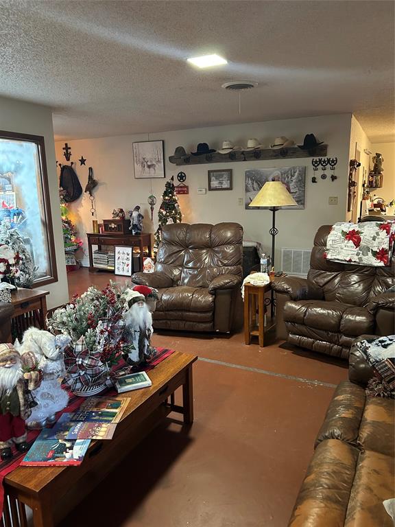 2020 Cedar Street Megargel, TX 76374 - Photo 6 of 29 a living room filled with furniture and a floor to ceiling window