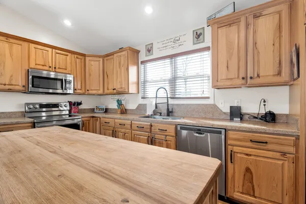 a living room with furniture and kitchen view
