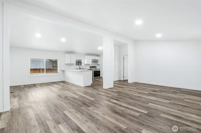 a view of a kitchen with wooden floor