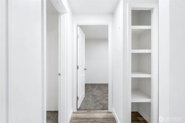 a view of an empty room with a window