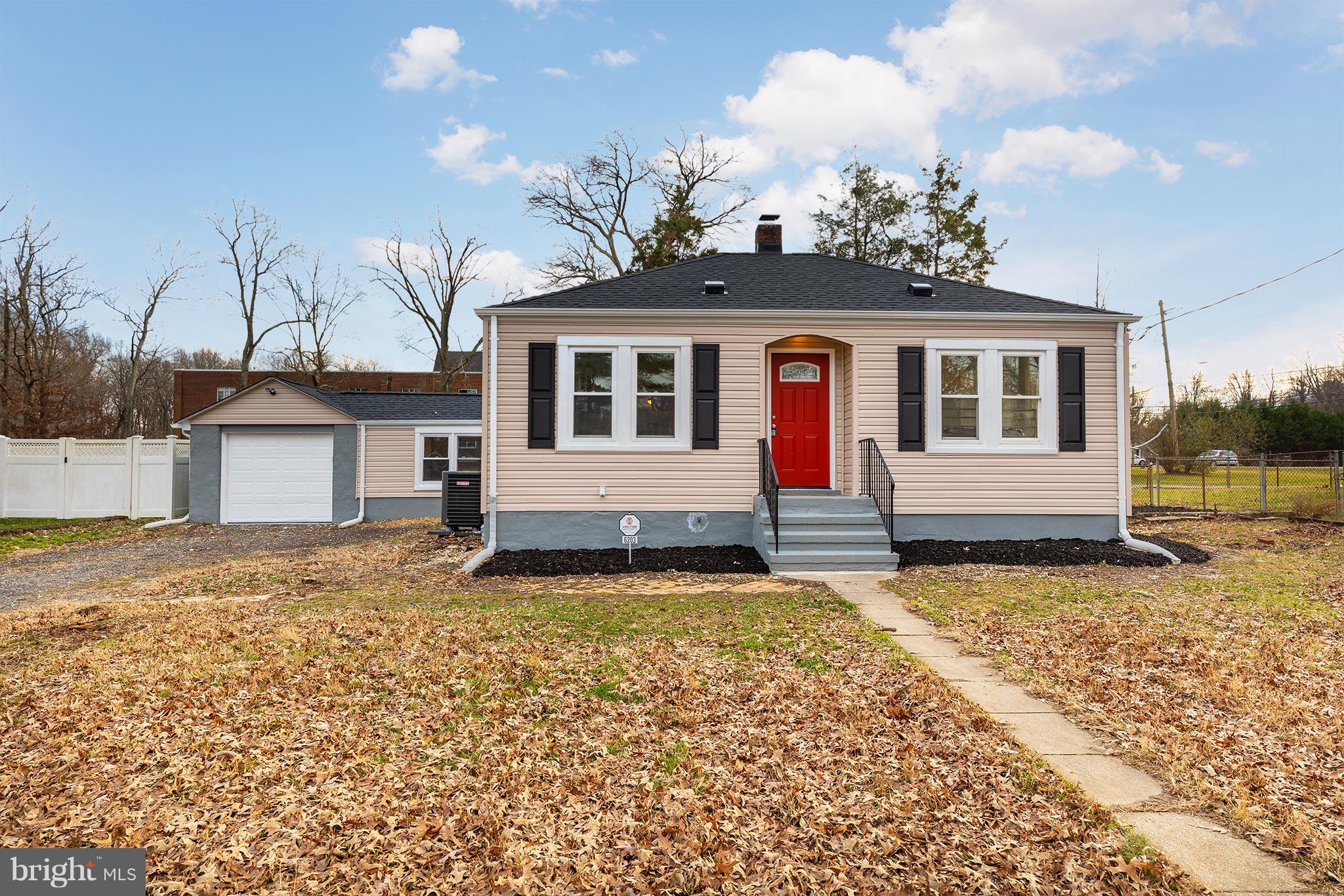 6203 Woodley Road Clinton, MD 20735 - Photo 1 of 38 a view of a house with a yard